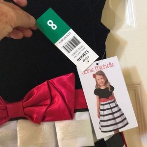 Brand new with tags Jona Michelle velvet dress girls size 8. Black with red bow